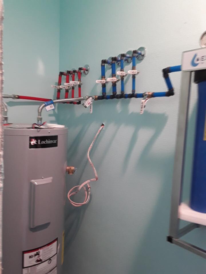 Clean water heater and PEX manifold installation by Evenflow Plumbing